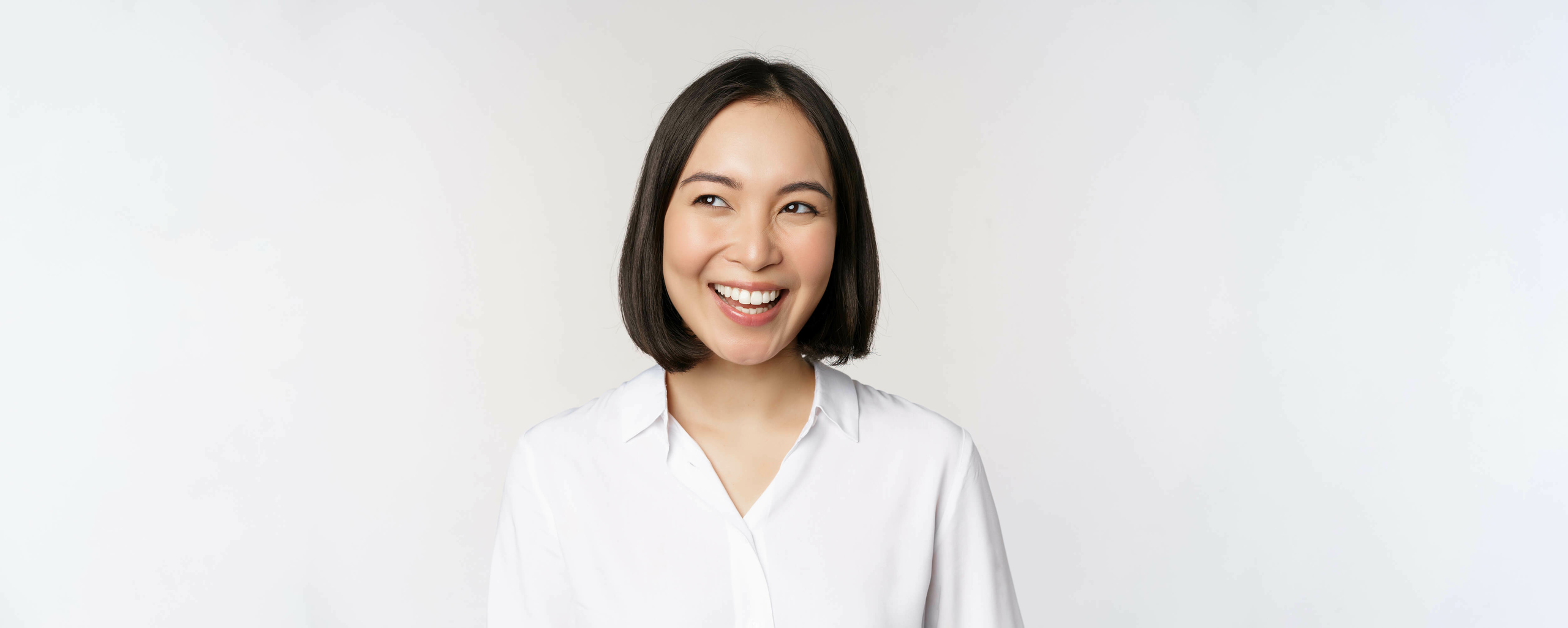 Image smiling asian woman planning thinking smth daydreaming standing white background with smug face copy space