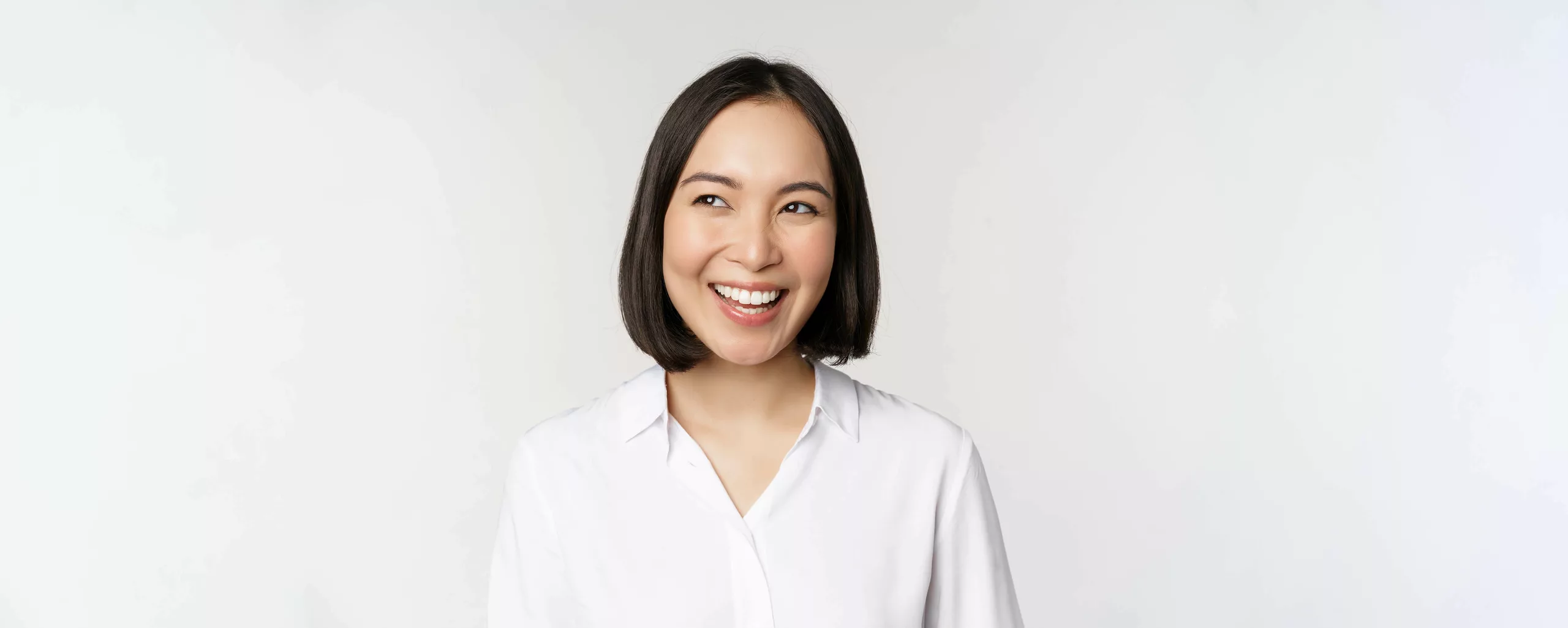 Image smiling asian woman planning thinking smth daydreaming standing white background with smug face copy space
